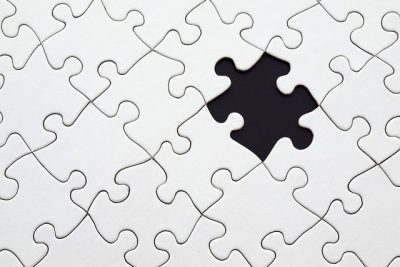 missing teeth represented by puzzle